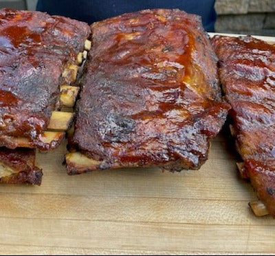 Barbecue ribs on a wooden cutting board